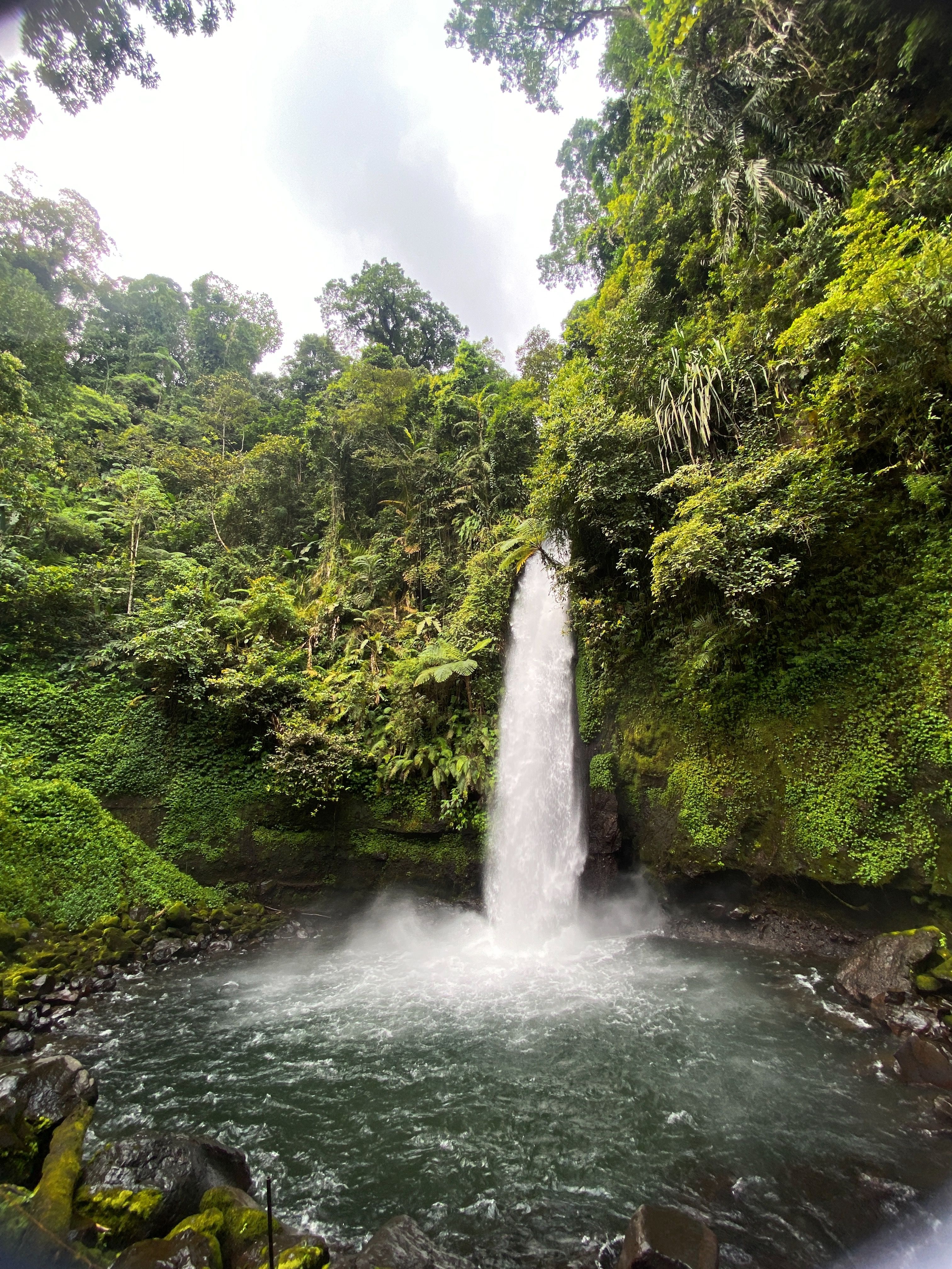La Fortuna Waterfall powerful drop into the blue pool